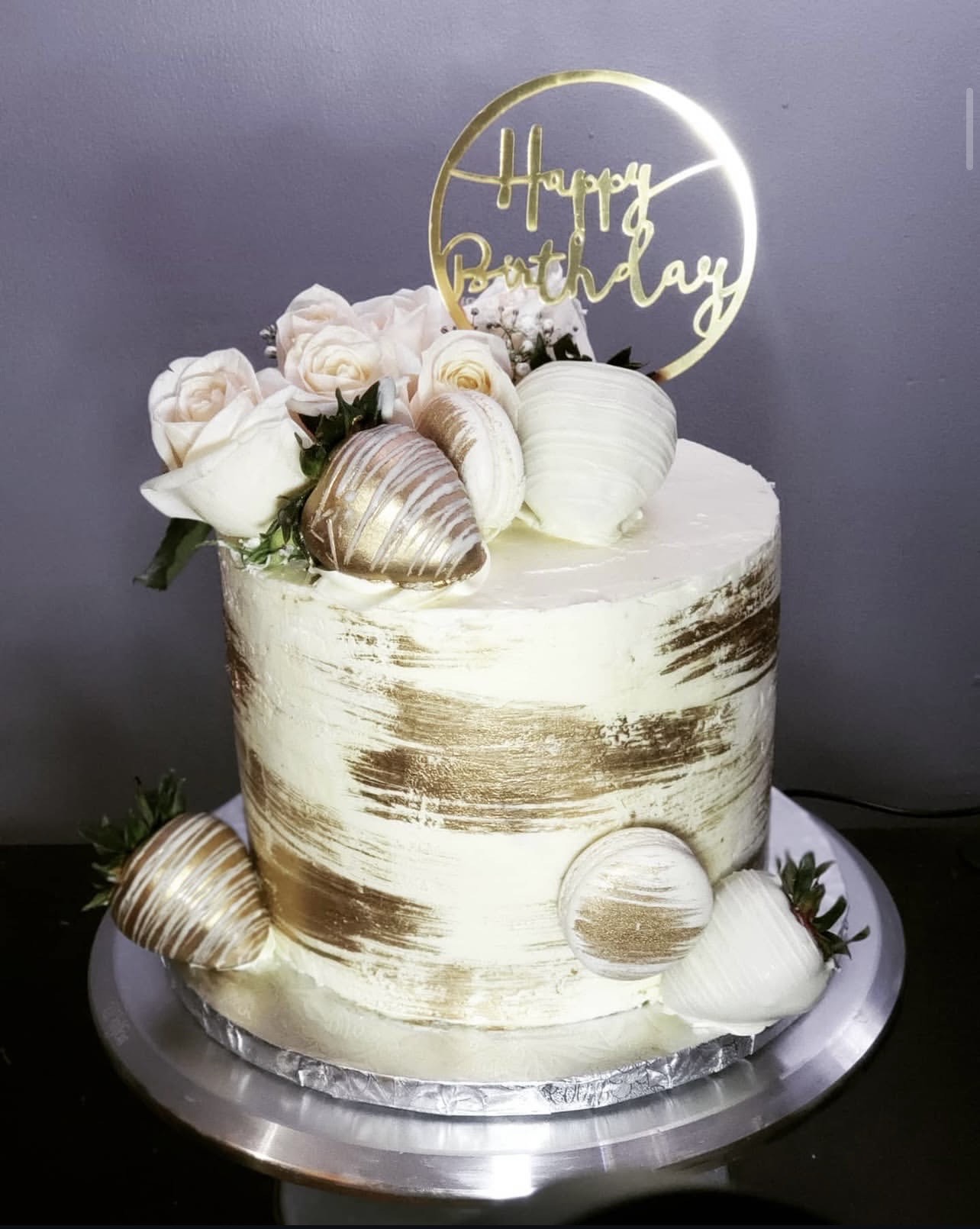 Tall white and gold cake